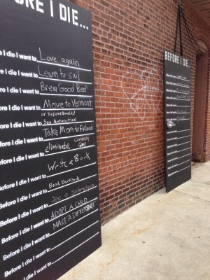 Before I Die interactive public Art Project, located beside Eureka Puzzles in Coolidge Corner, Brookline, Ma
